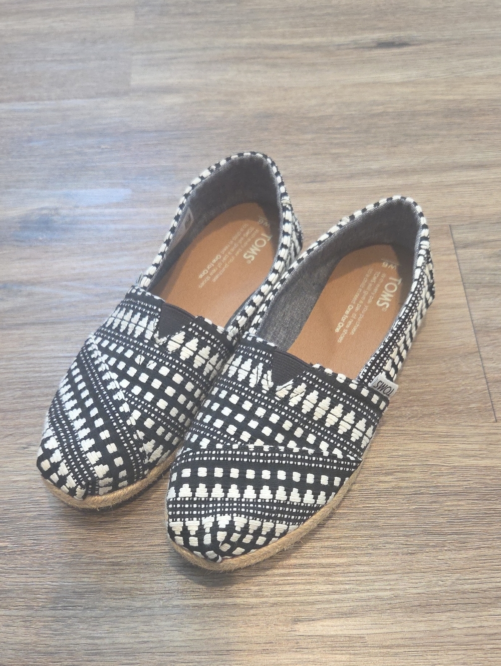 Toms Black and White Geometric Slip-On Flats